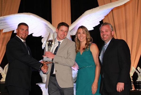 Project team posing with awards.